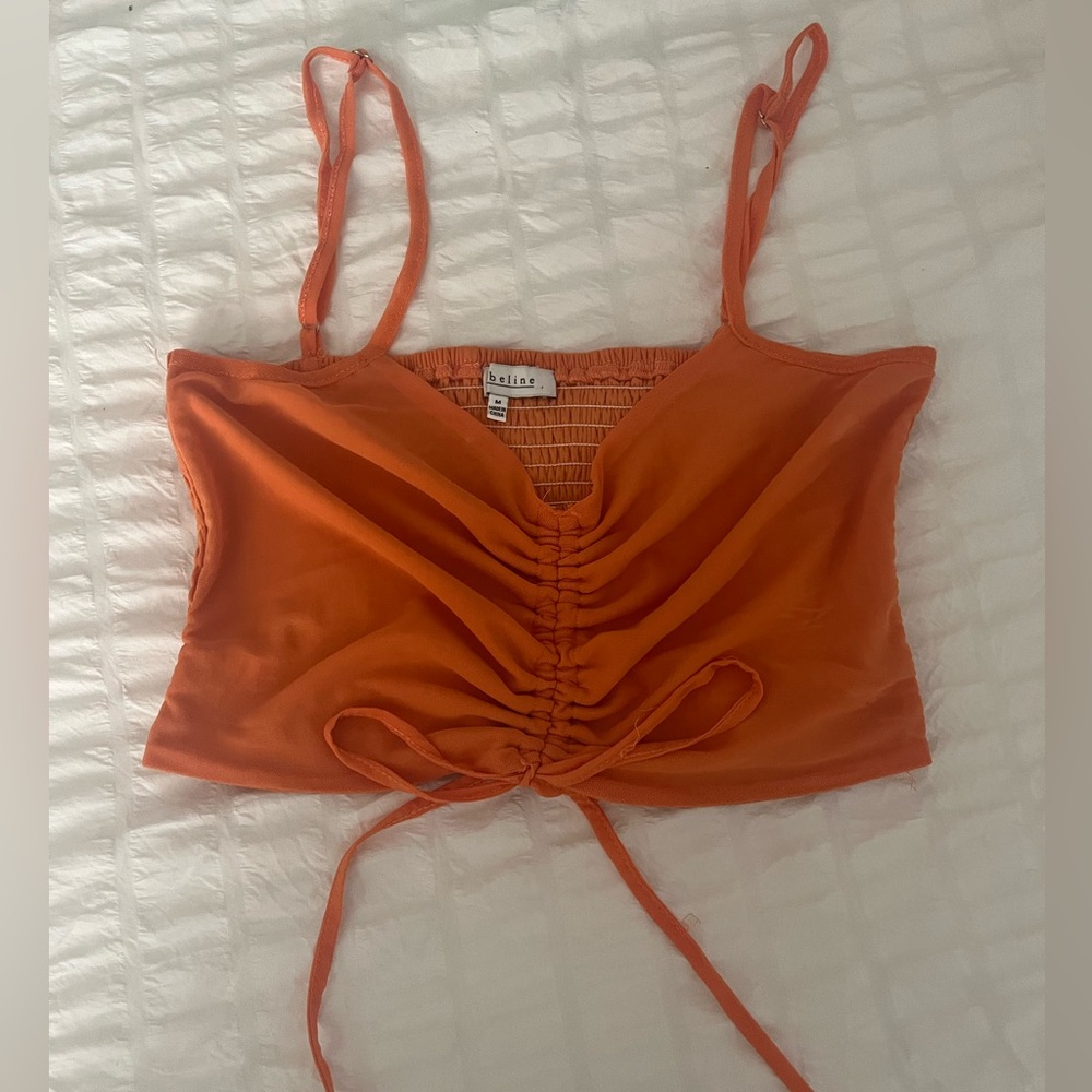 Orange ruffled crop top